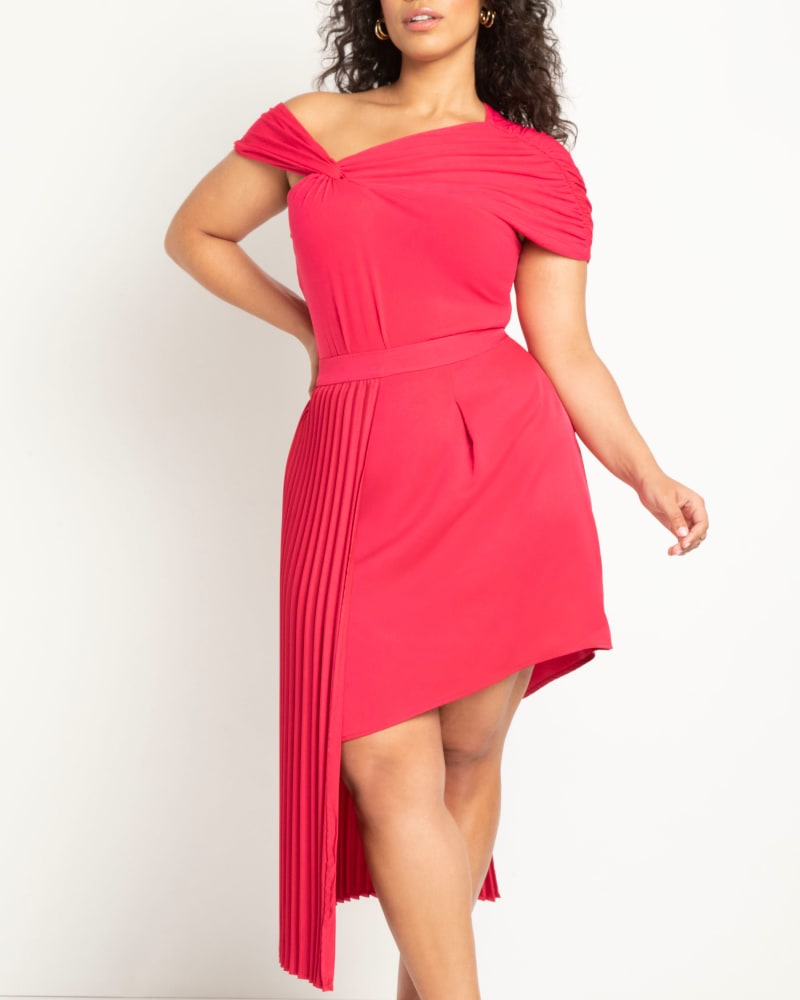 Front of a model wearing a size 24 Asymmetrical Pleated Skirt in Love Potion by ELOQUII. | dia_product_style_image_id:300055